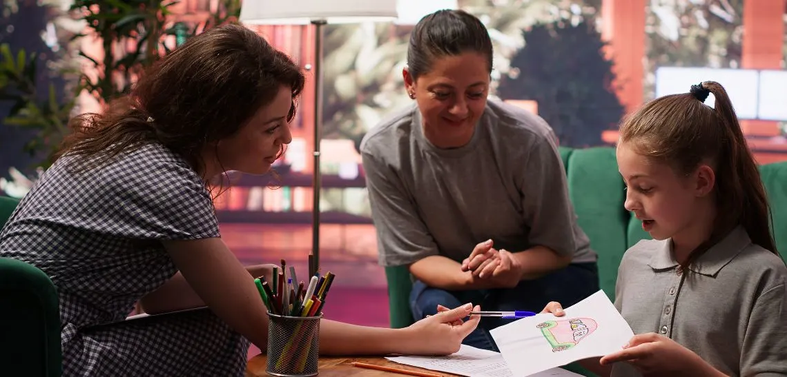 Child welfare caseworker from a foster care agency in Oklahoma explaining the difference between traditional and therapeutic foster care to new foster parents during a home visit